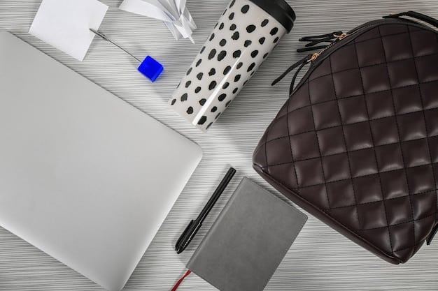 A close-up shot of a well-organized tote bag with various compartments, including a laptop sleeve, phone pocket, and a zippered section for valuables. The bag is filled with everyday essentials like a notebook, water bottle, and wallet.