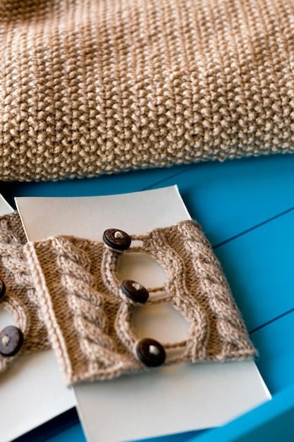 A close-up shot of various fabric swatches including linen, wool, and cotton, showcasing different textures and colors suitable for Spanish wedding suits under natural light.