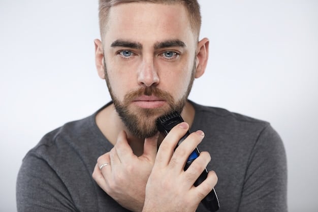 Close-up shot of a man's face, focusing on his perfectly trimmed goatee. The background is blurred to emphasize the beard style. The image is high-resolution, showing the details of the hair and skin texture.