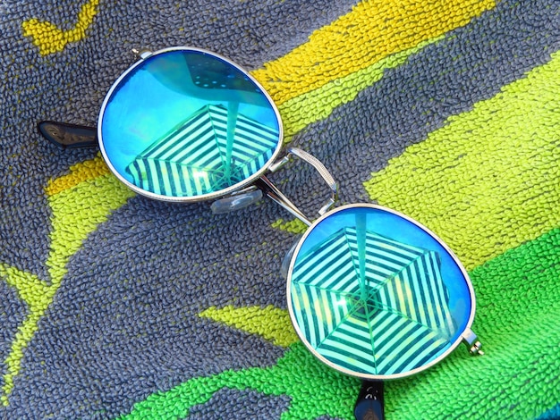 Close-up of a pair of sunglasses made from recycled plastic, showcasing the texture and detail of the sustainable material.