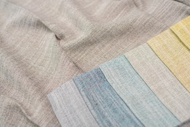 A close-up displaying the different textures of various shirt fabrics (cotton, linen, polyester), with a brief explanation of how each type of fabric wrinkles.