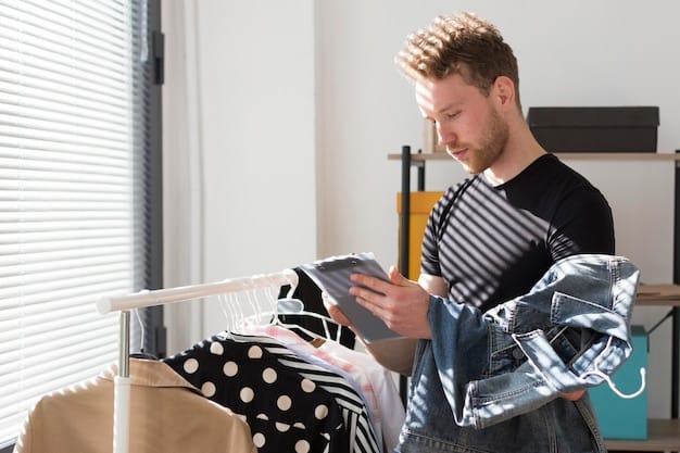 A man making a list on his phone while sorting through clothes in his closet. The closet contains a variety of men's clothing items, from shirts and sweaters to pants and jackets, reflecting a diverse wardrobe.