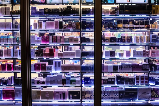 An eye-level shot of a modern electronics store in Barcelona, Spain. The shelves are stocked with various gadgets and devices. Small price tags with slight increases are subtly visible, hinting at the potential impact of the recycling law on retail prices.