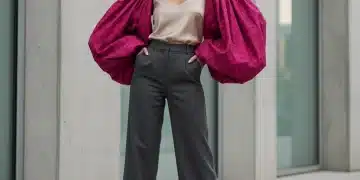 Woman in a vibrant blouse with voluminous statement sleeves, embodying bold fashion
