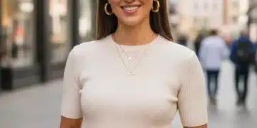 Stylish woman showcasing affordable layered necklace and chunky hoop earrings